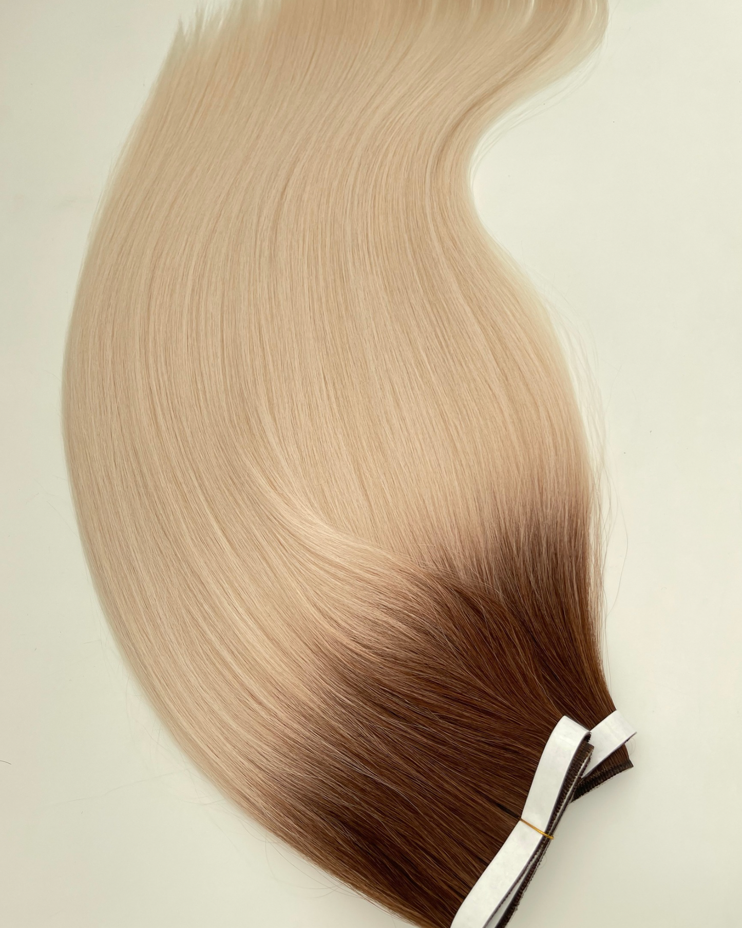 26” 200g Tape-In Weft Bio-Protein Fibre Rooted Bleach Blonde